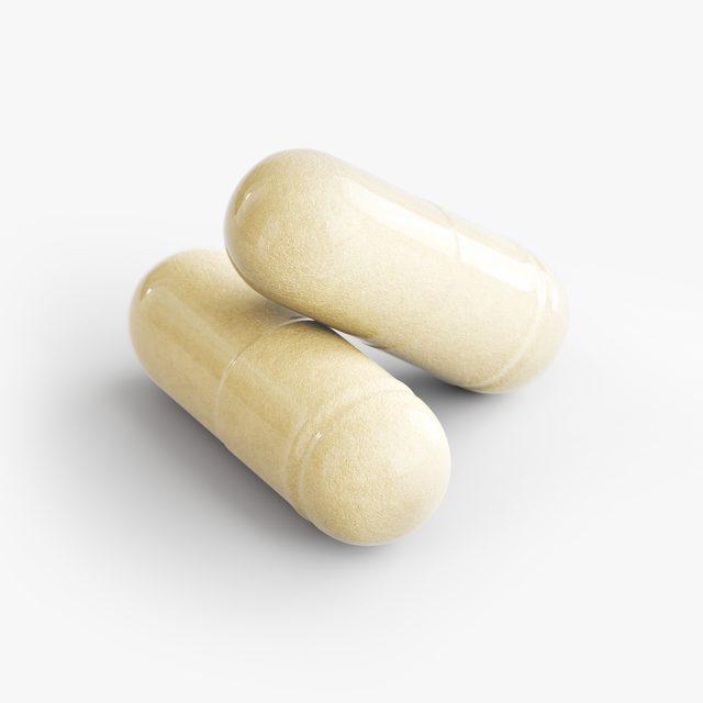 A pair of Human Runtime Core™’s capsules close up, the powder inside showing through the shell.