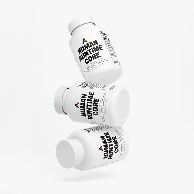 Three bottles of Human Runtime Core™ balanced one on another, their labels turned different ways.
