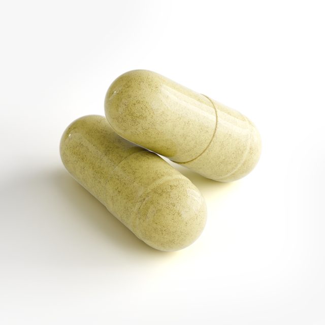 A pair of Human Runtime Power™’s capsules close up, the powder inside showing through the shell.